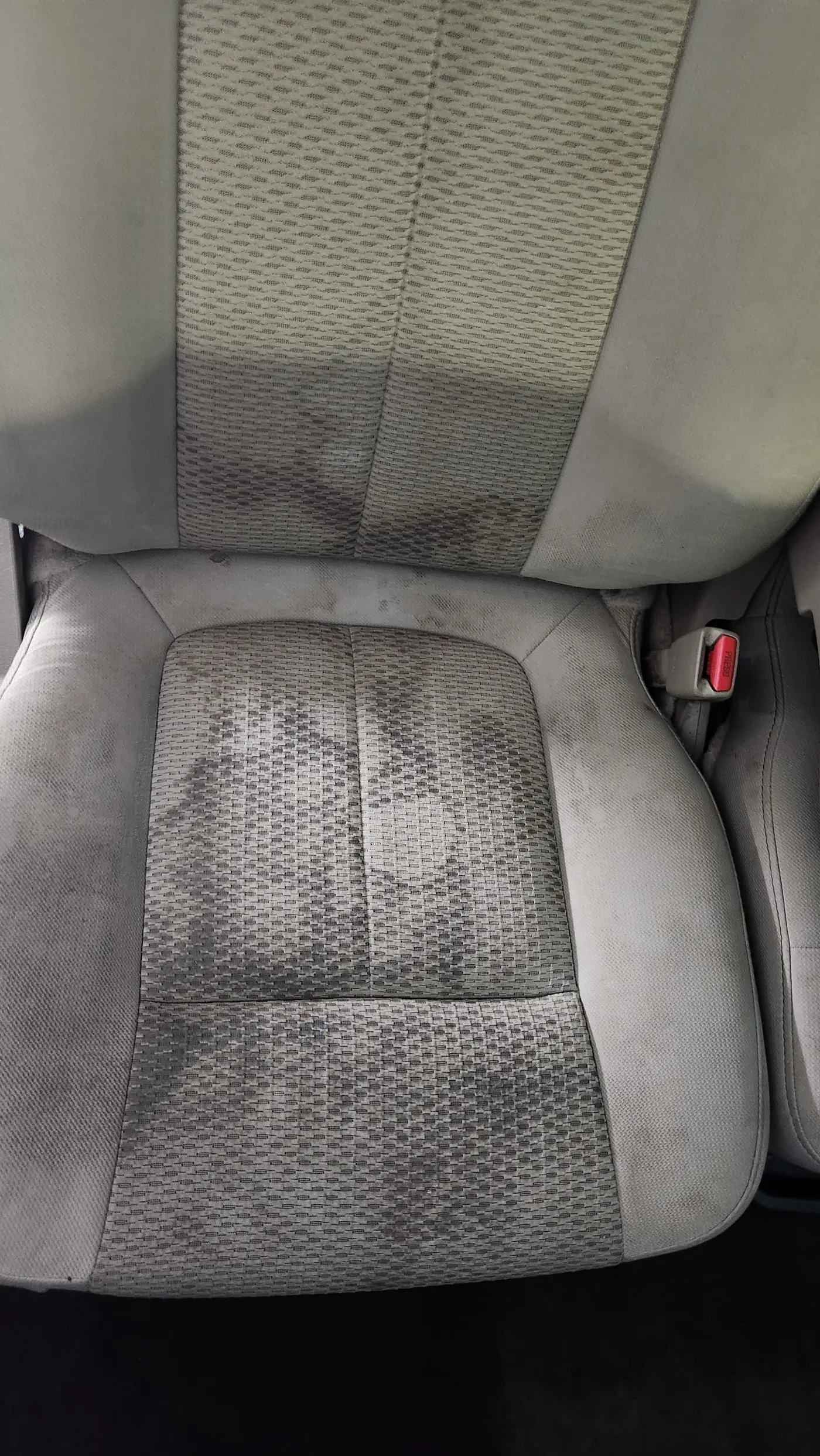 Dirty car dashboard before detailing in Montreal